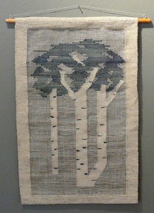 Blue weaving opf poplar trees on white fabric
